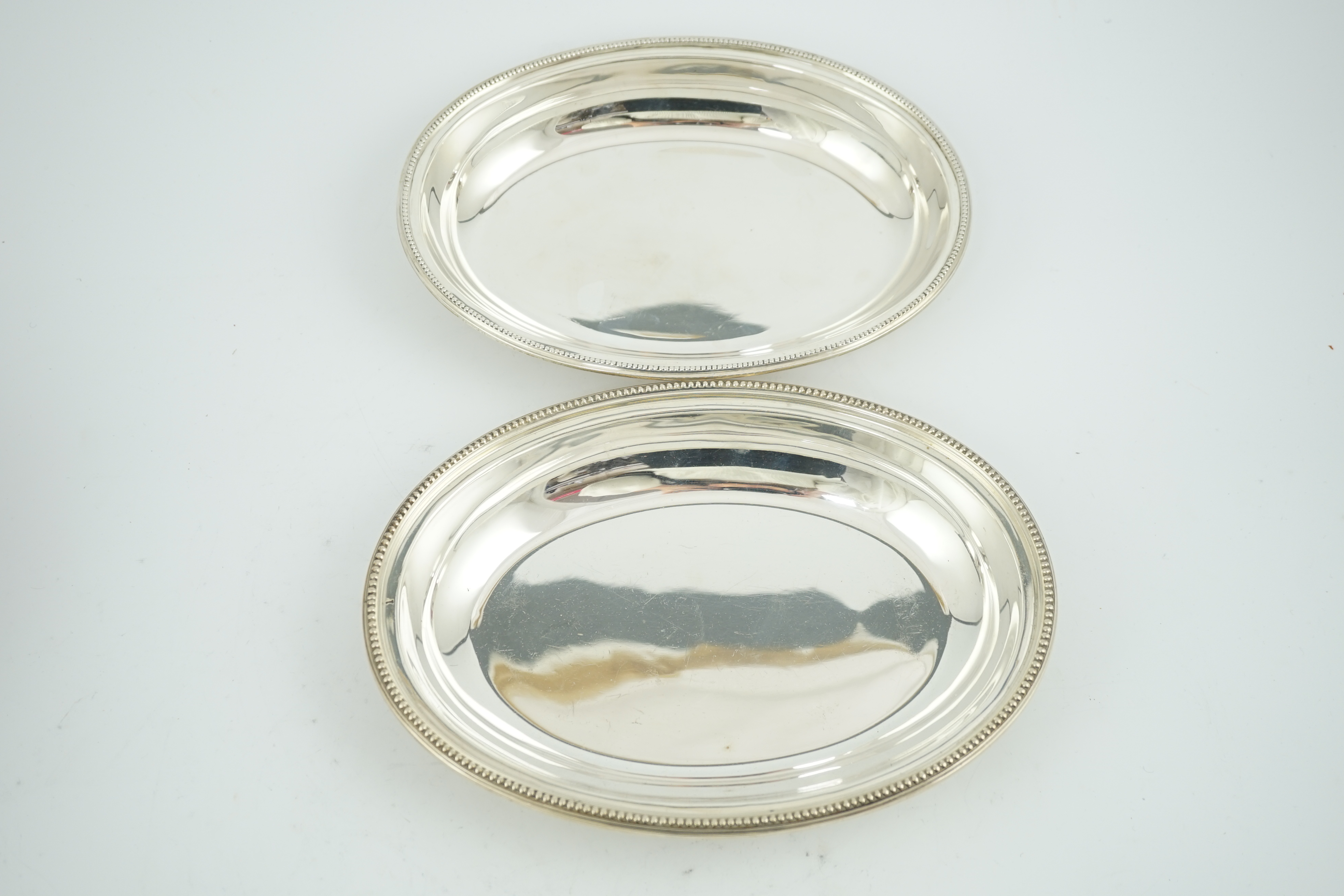 An Edwardian silver oval entreé dish and cover, lacking handle, by Goldsmiths & Silversmiths Co Ltd